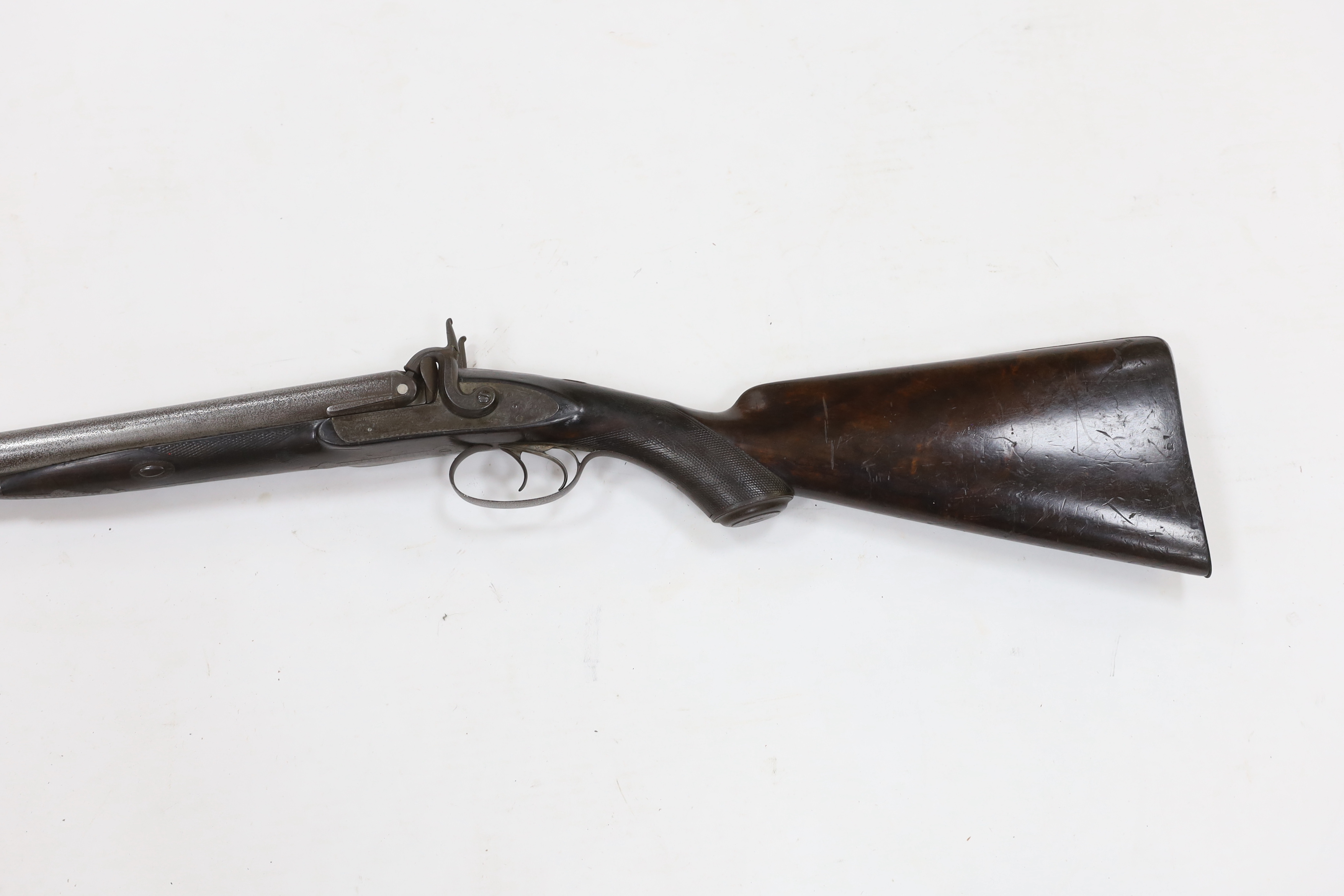 A double barrel, percussion sporting gun by F.T. Baker, half stocked, locks engraved with gundogs, iron mounts, barrels 74cm